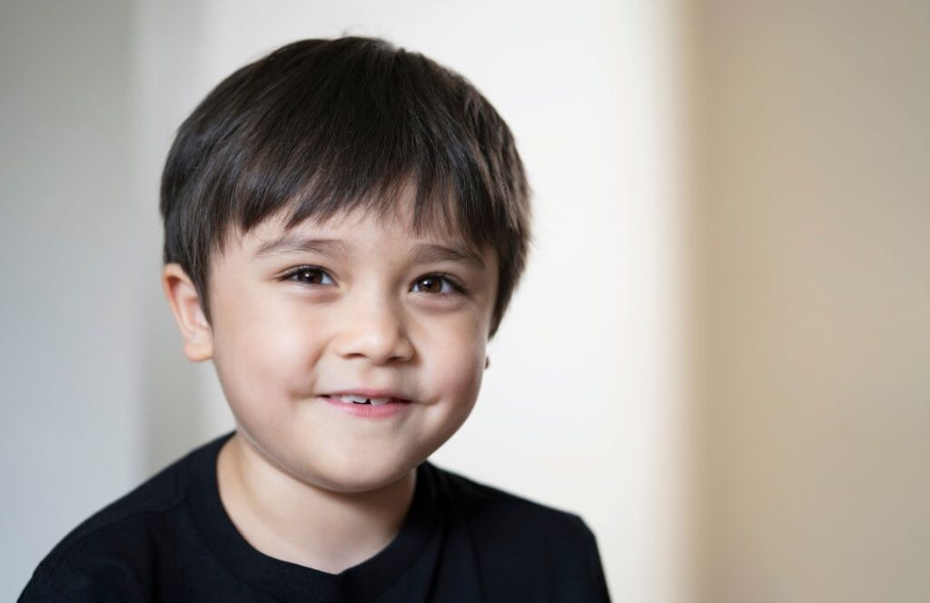 head shot kid looking at camera with smiling face 2025 02 24 10 17 49 utc
